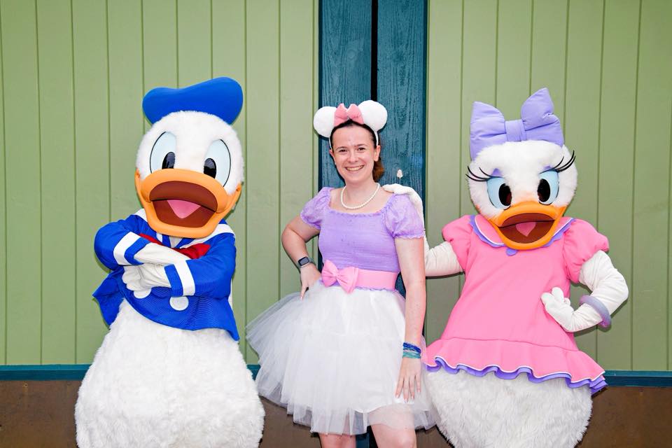 Guest Disneybounding as Daisy Duck with Donald and Daisy at Disneyland Paris
