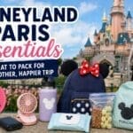 Family packing Disneyland Paris essentials including ponchos, portable charger, water bottle, snacks and stroller fan for a theme park day